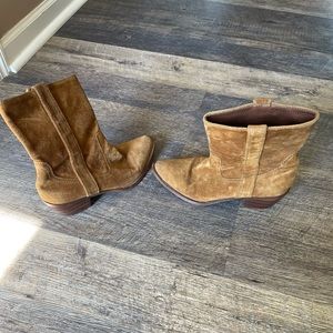 Tan ankle cowboy boots. Bottom of boots are torn up.